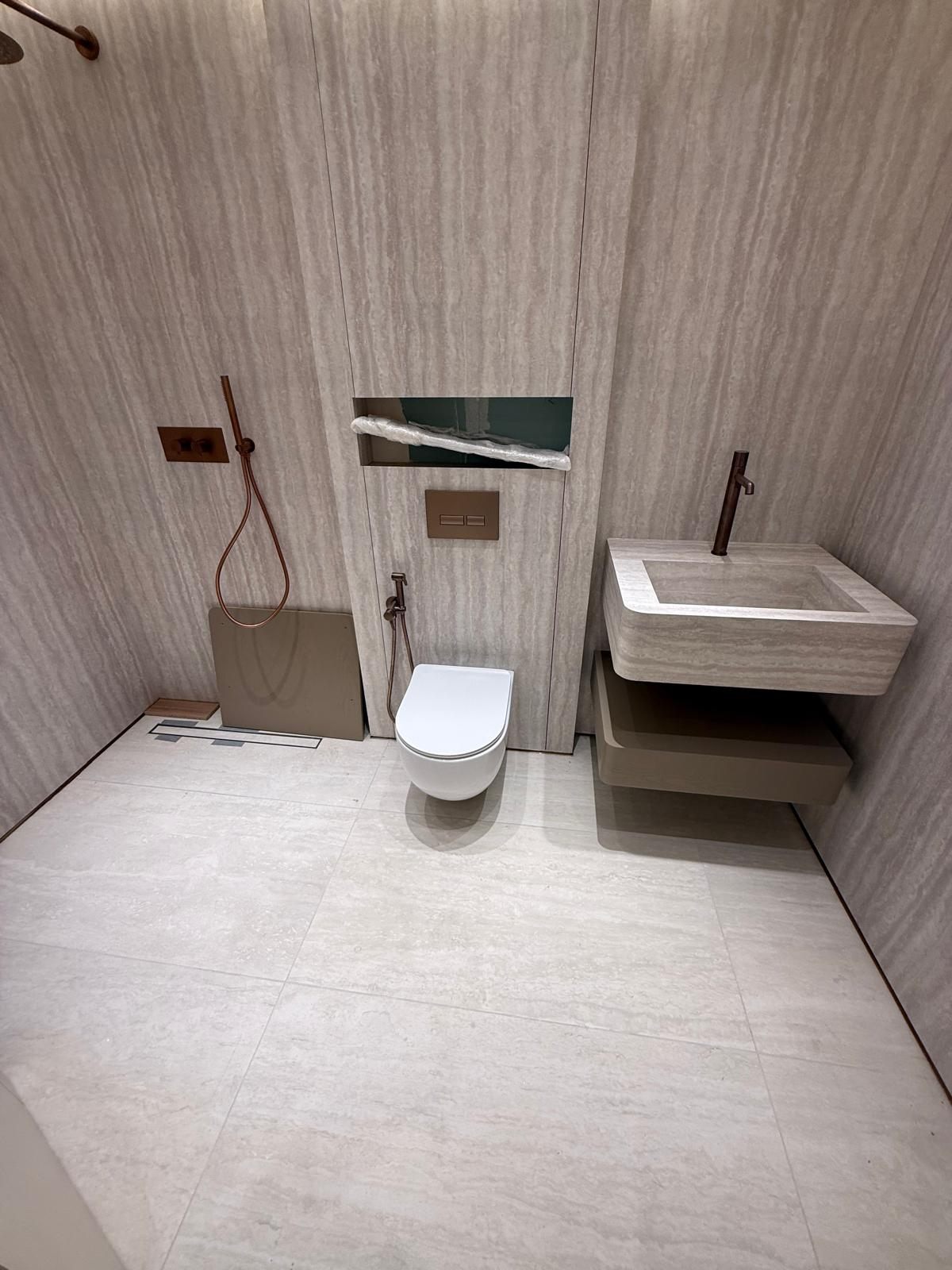 Shower room with a wall-hung WC and floating basin
