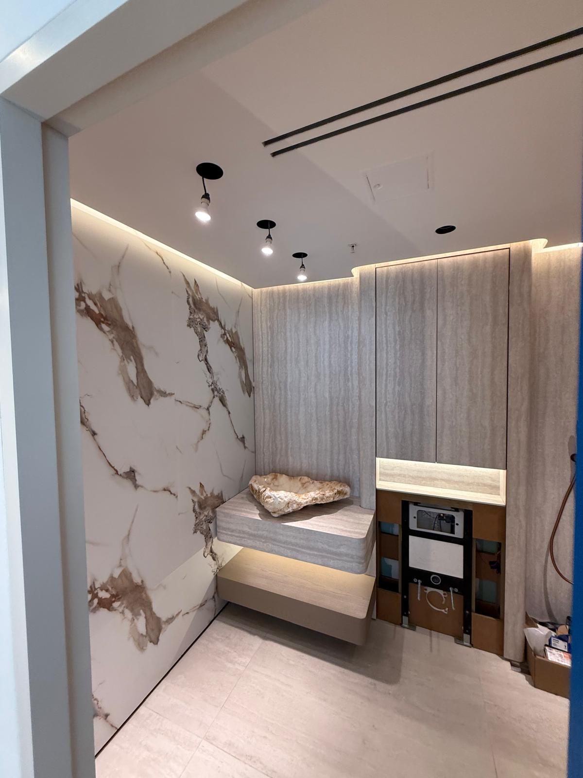 Bedroom nook with a marble feature wall