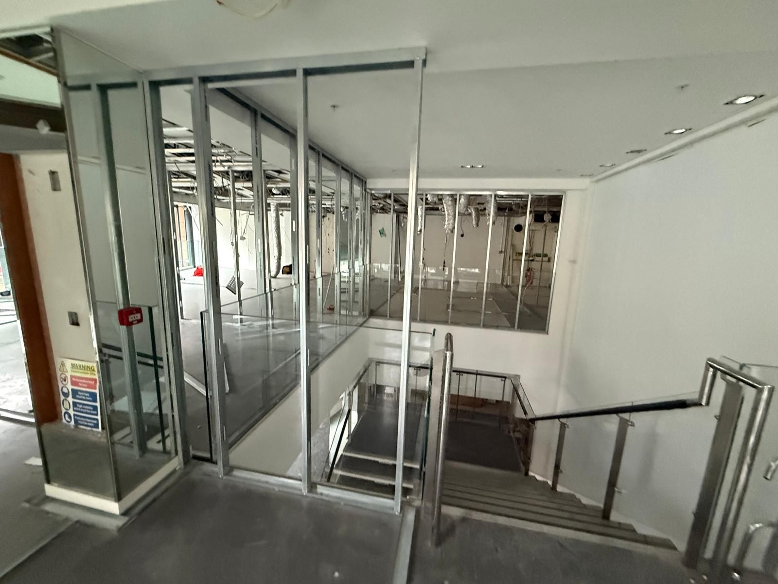 Glass partitions going in around the stairwell