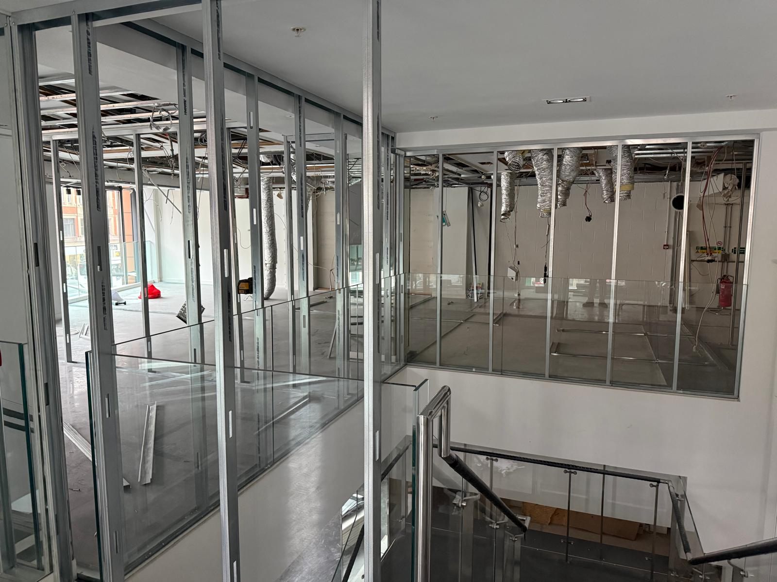 Metal stud and glazed partitions before finishing