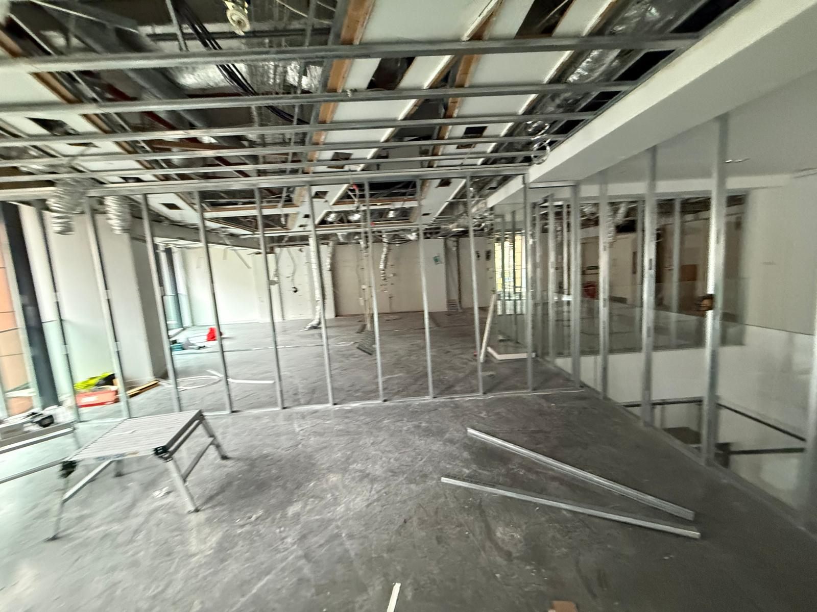 Bare floor with the stud framework and open ceiling